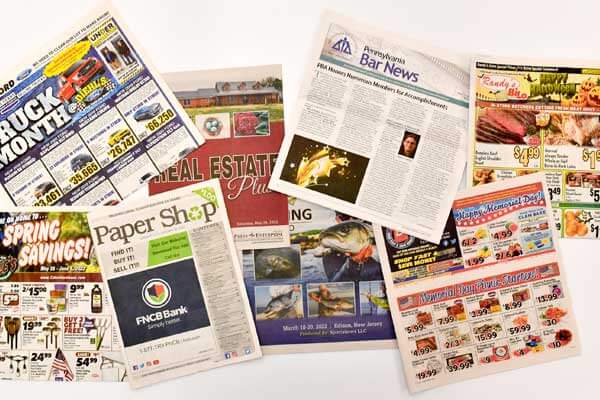 Ads in newspaper by Press Enterprise Commercial Printing