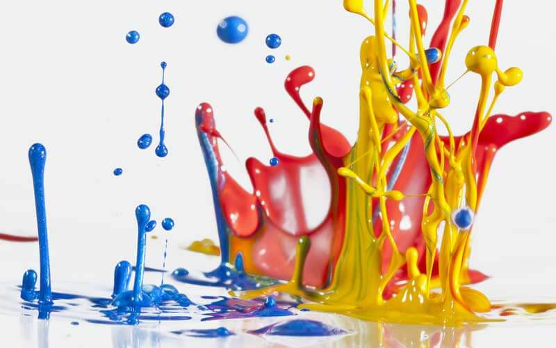 Graphic of red, blue and yellow paint splashing Press Enterprise Commercial Printing